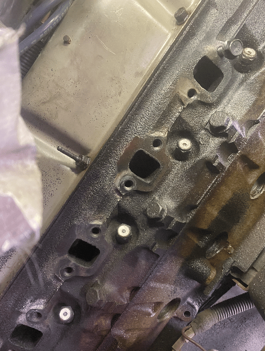 Engine cylinder head intake ports prepared for gasket installation and sealing